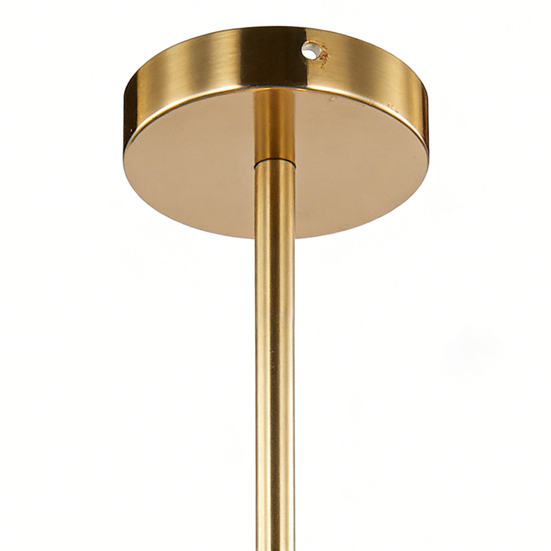 Clear globe pendant light showing brass ceiling mount canopy detail