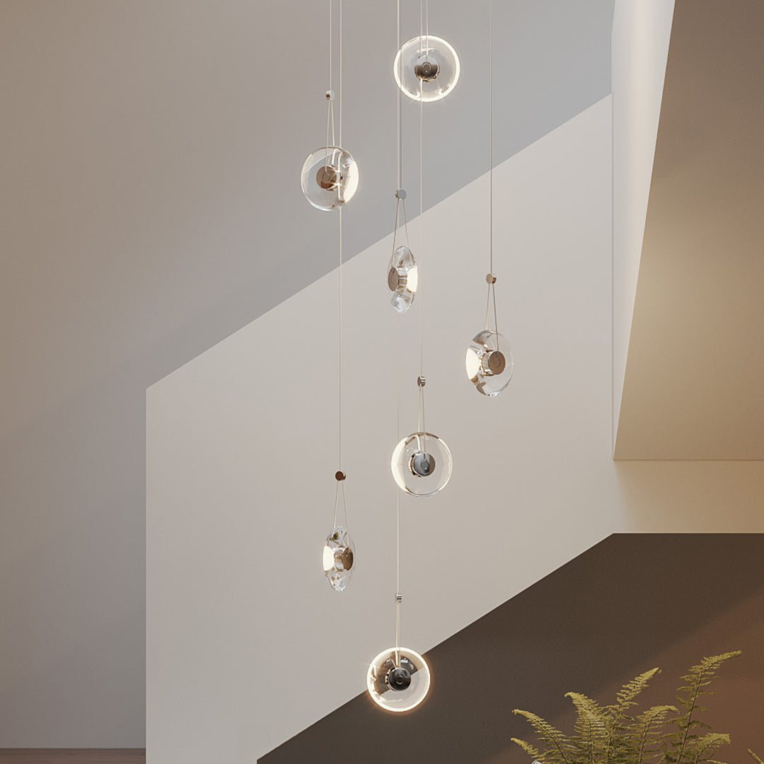 Aureon transparent pendant light in a contemporary open-plan living room setting