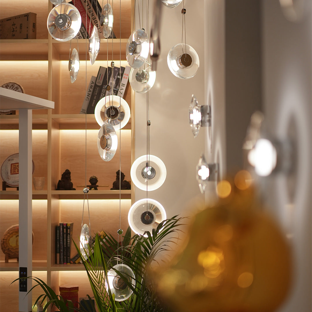 Aureon clear crystal pendant light in a modern interior with warm ambient lighting