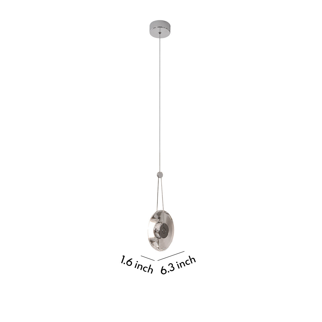 Single Aureon clear crystal pendant light in a minimalist modern room