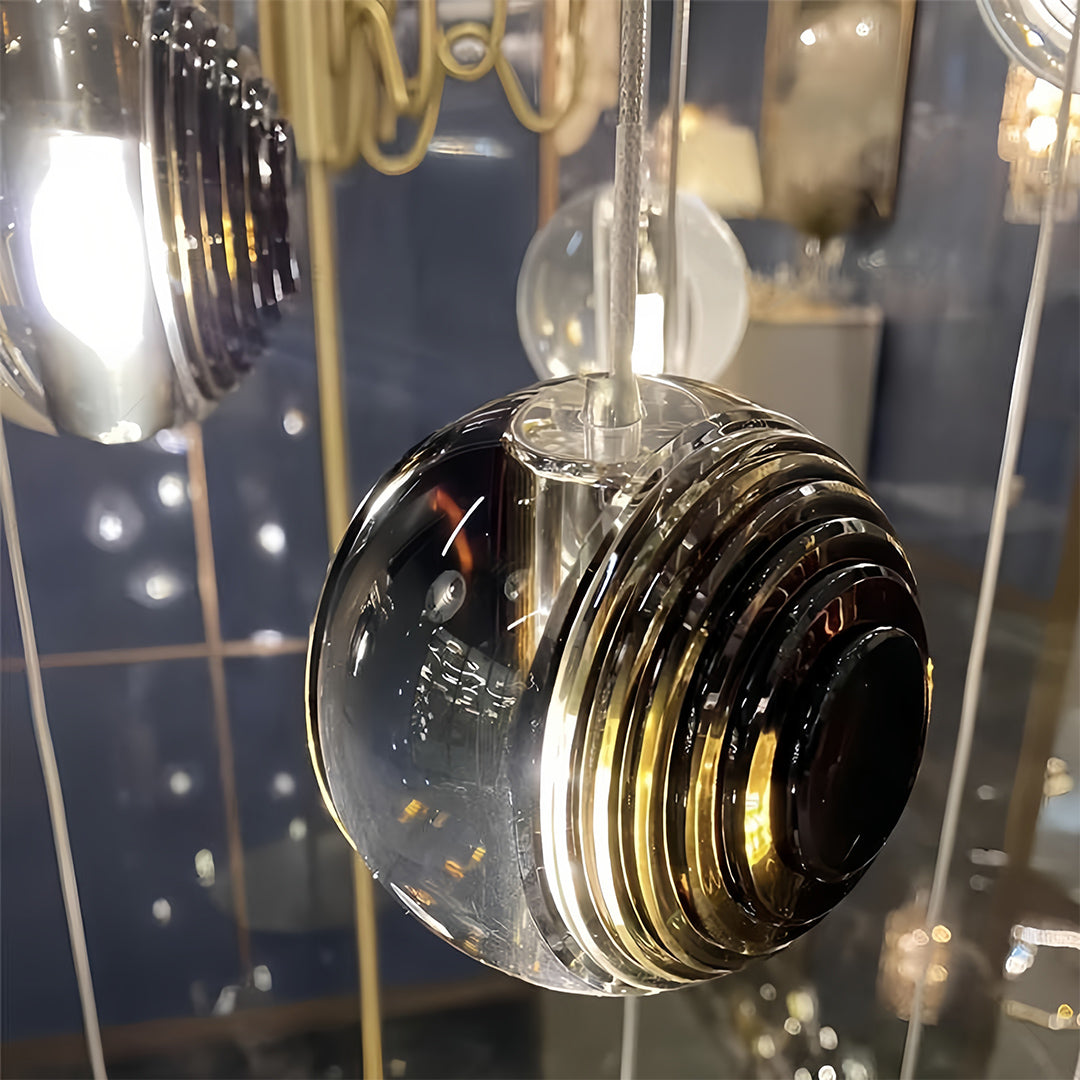 Close-up of Aureon smoked glass sphere pendant light, reflective and textured glass surface