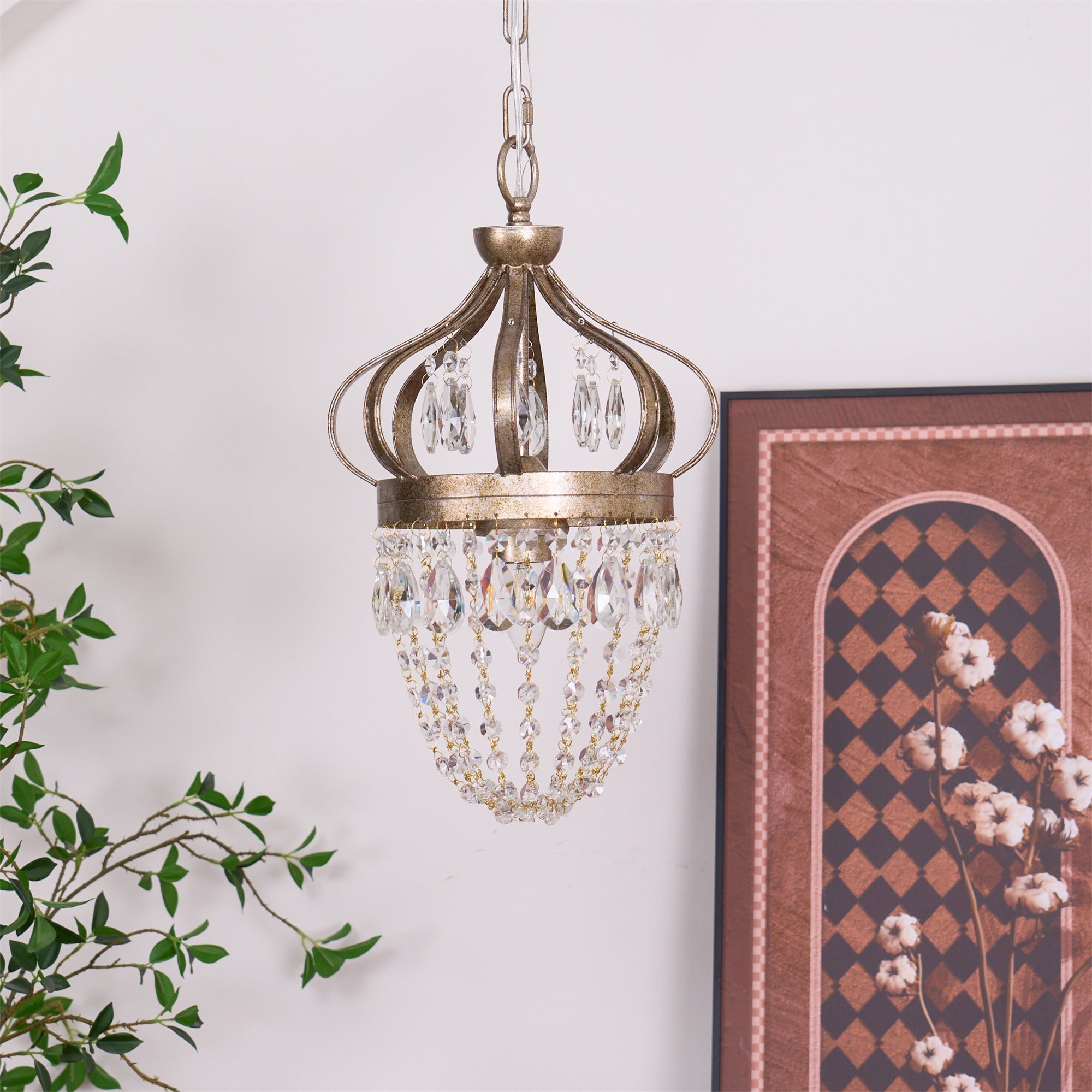 Vantara chandelier in antique gold installed in a double-height entryway