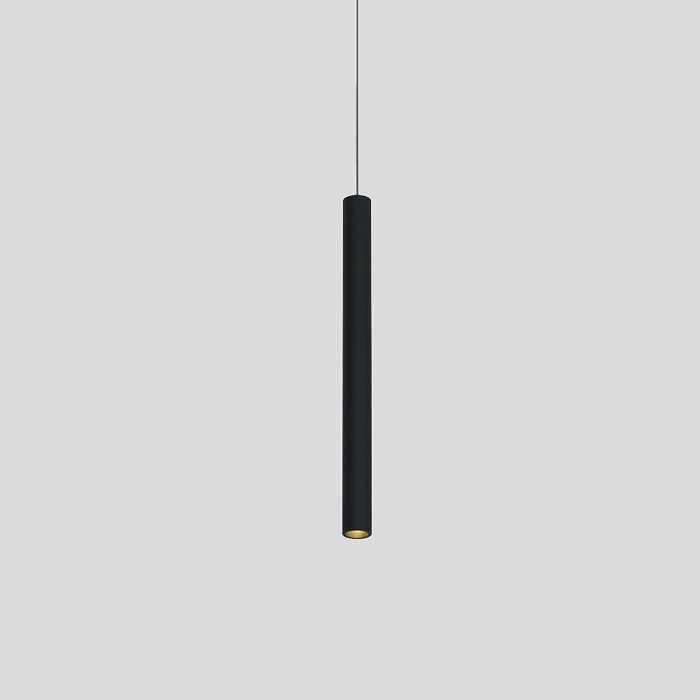 Aureon cylinder pendant light in white with cool white light above a contemporary dining area