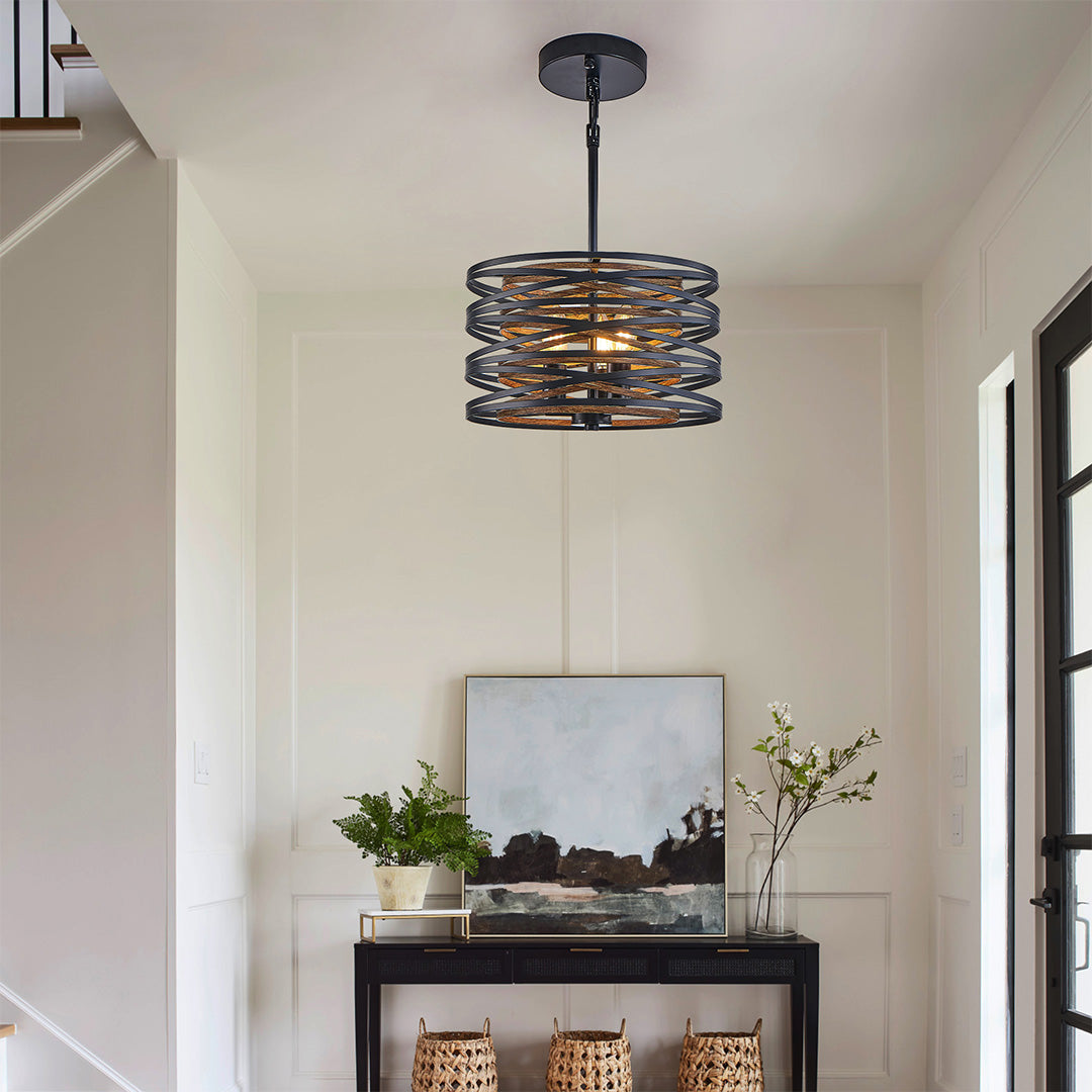 Aureon black iron cage pendant light with exposed E12 bulb socket detail