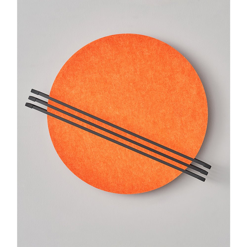 Vantara felt wall sconce glowing with warm light, showing integrated LED diffusion through orange felt disc