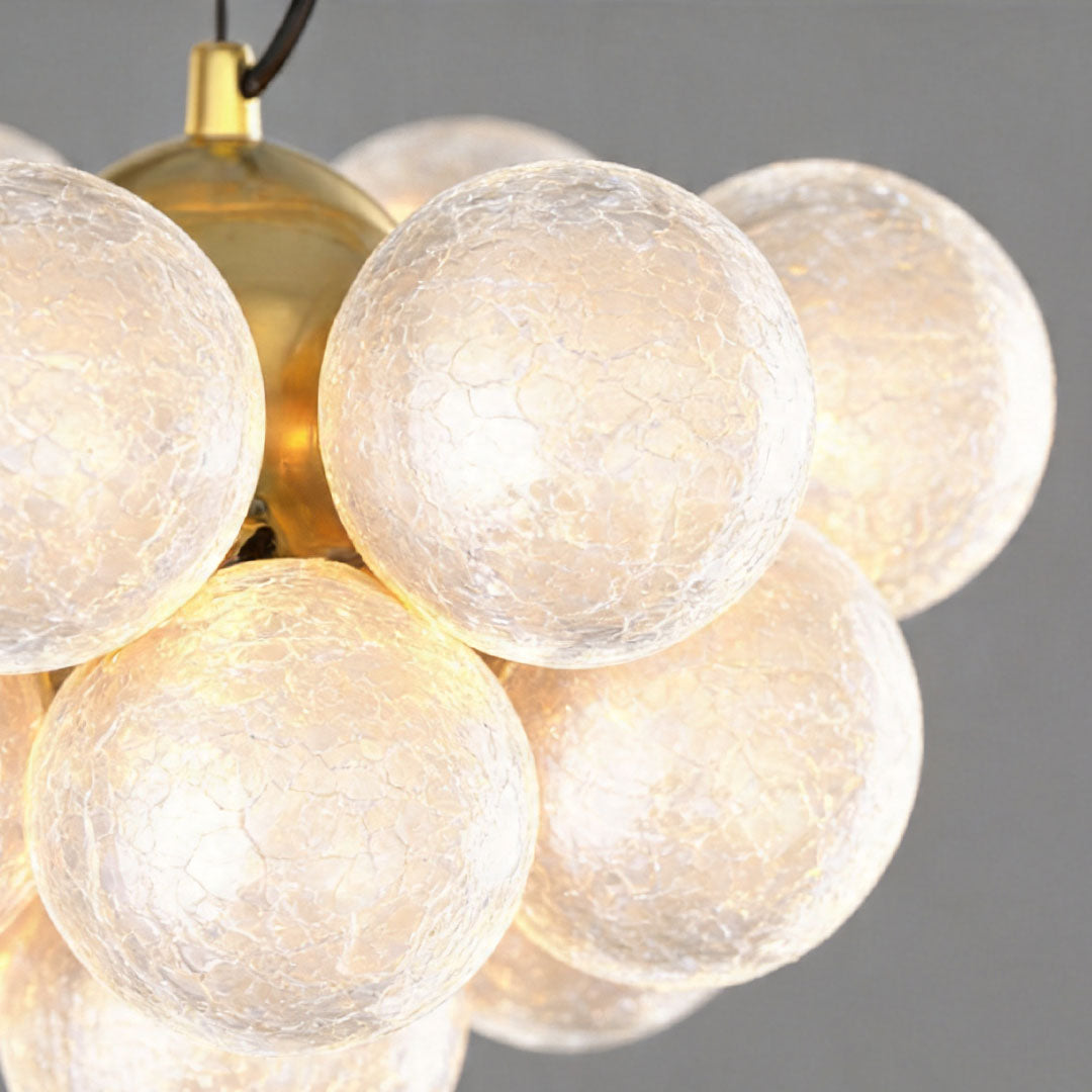 Detail shot of white glass globe shade on the Auréline ceiling light