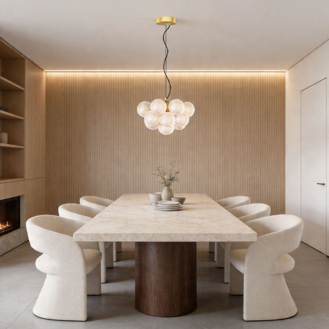 Auréline chandelier in a modern dining space, white glass globes casting warm light