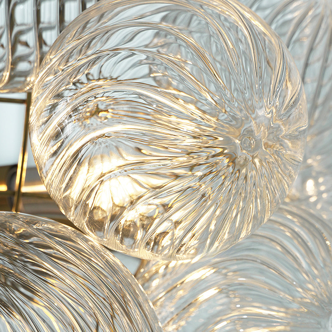 Close-up of Auréline swirl-patterned glass disc shade detail