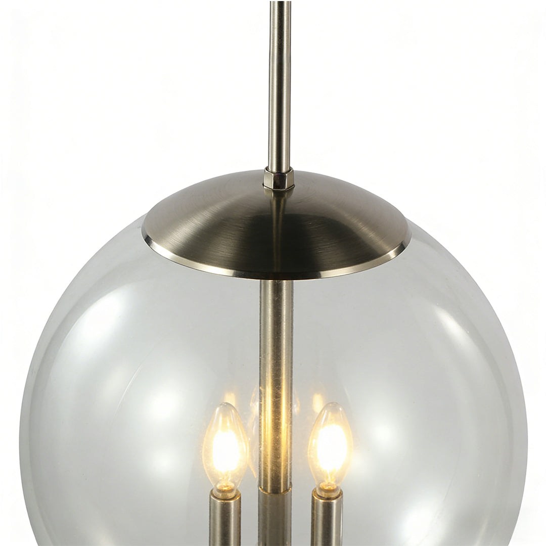Aureon clear glass orb pendant light with warm filament bulbs illuminated in a modern setting