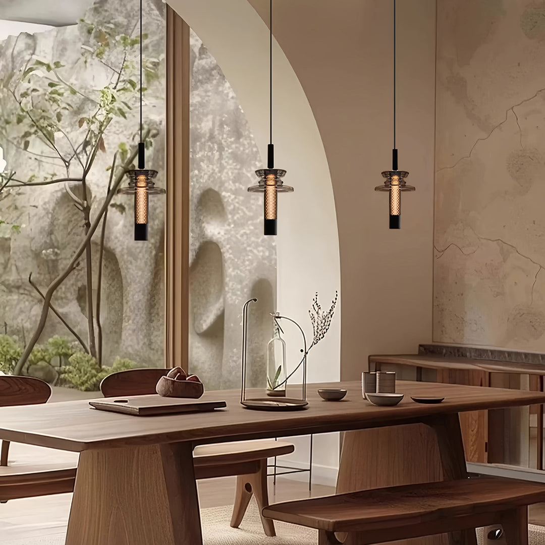 Set of Aureon geometric glass pendant lights above a rustic dining table display