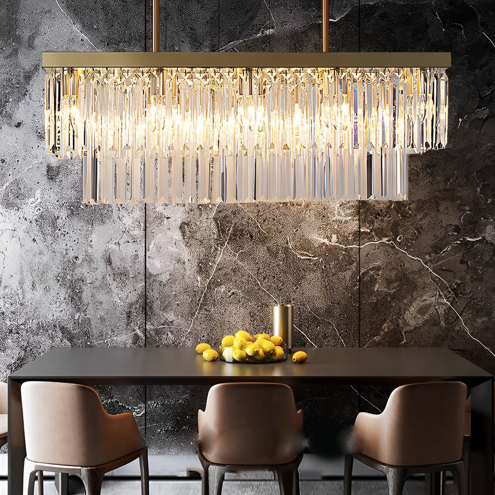 Gold crystal bar chandelier casting warm light in a contemporary living room