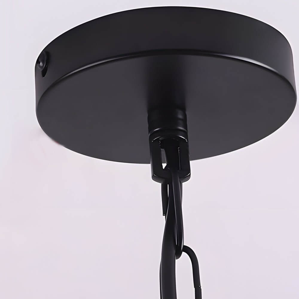 Aureon iron cage hanging pendant light in a modern living room with large windows