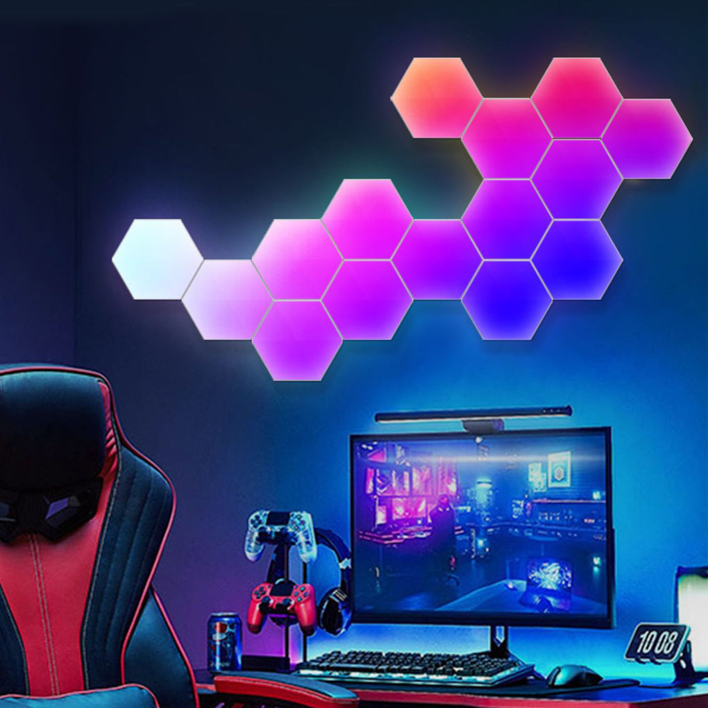 Modular hexagon LED wall lights glowing behind a gaming desk