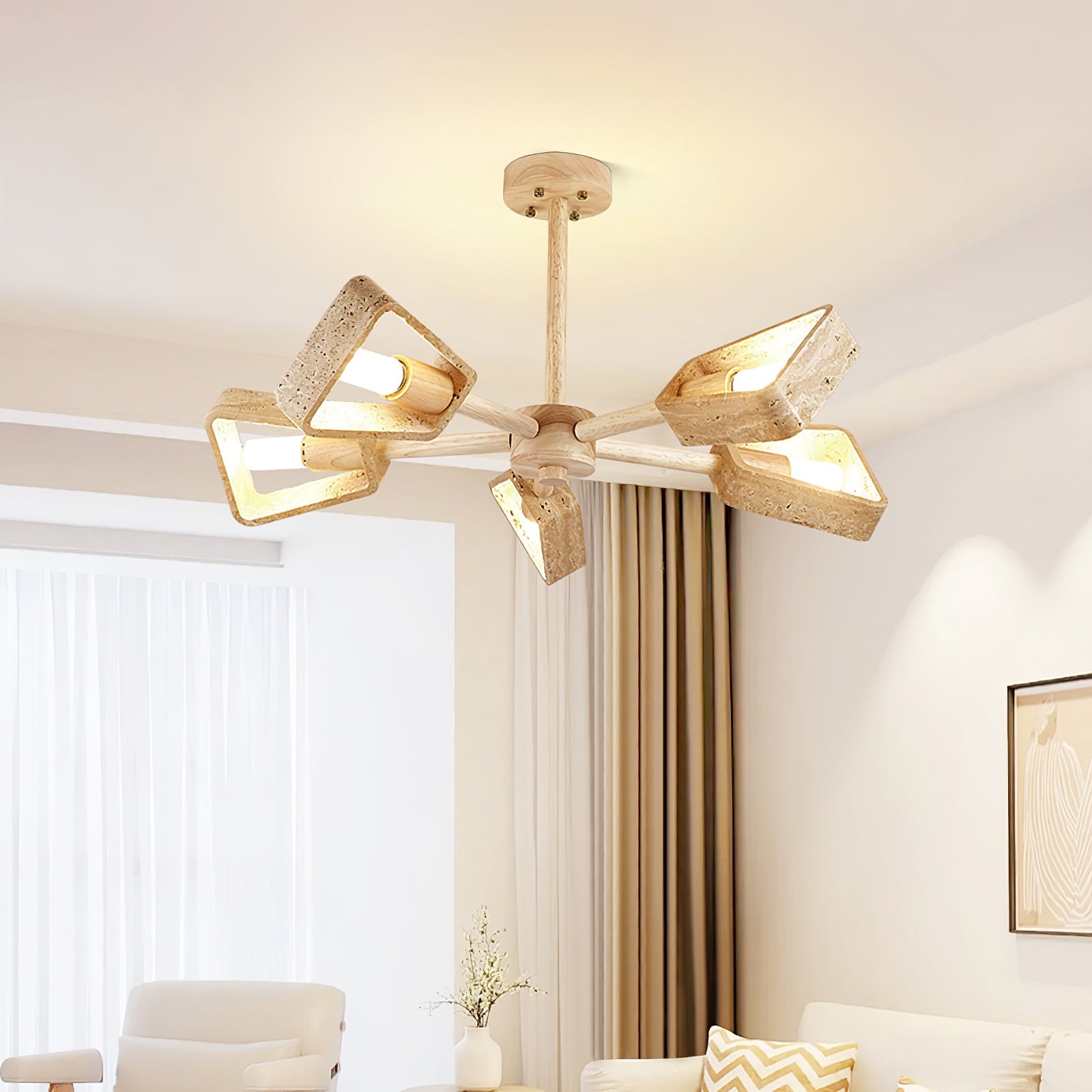 Tomoe Japandi chandelier above a round dining table in a bright neutral interior
