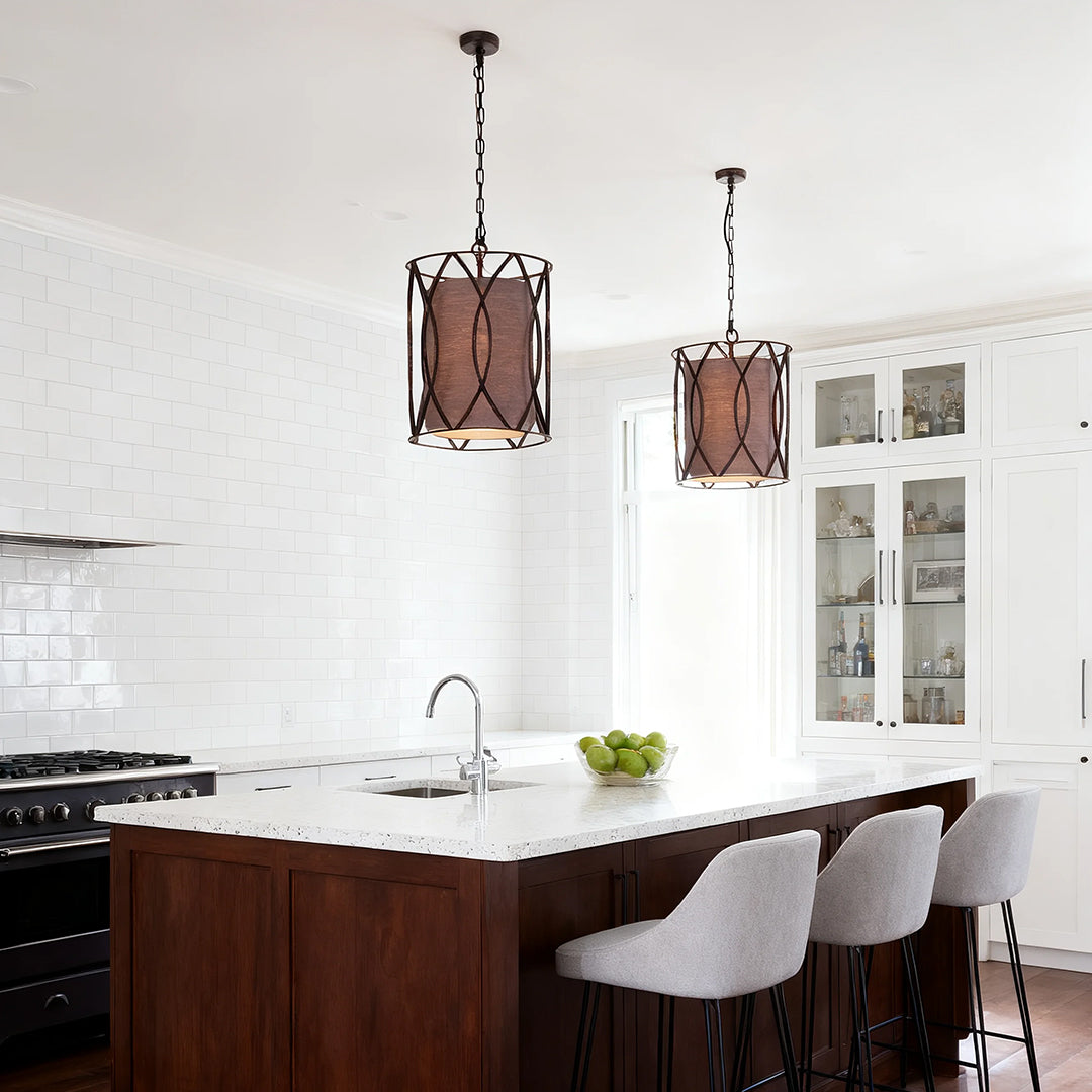 Aureon industrial black pendant light above a walnut kitchen counter in a modern interior
