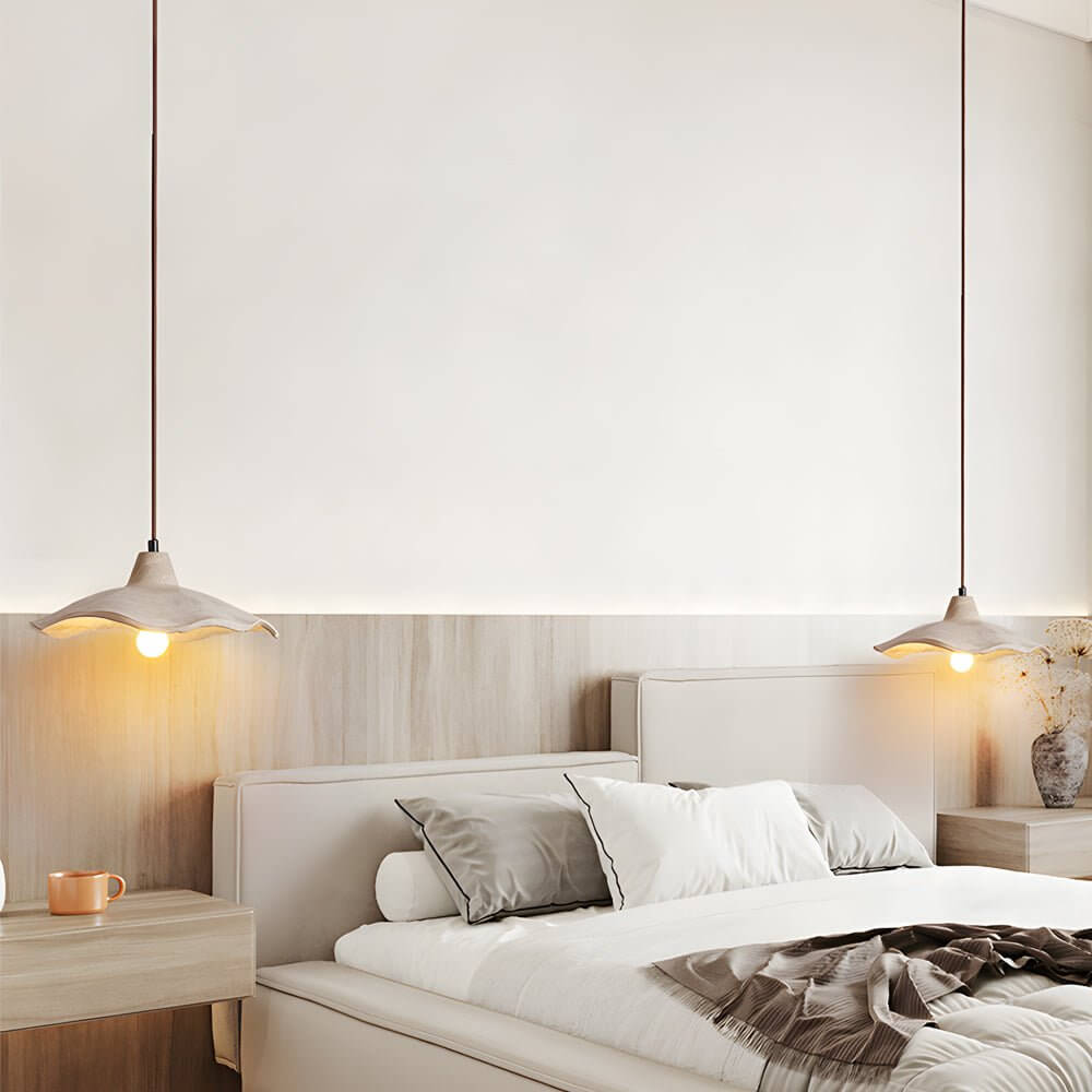 Aureon wave cement ceiling pendant light in a minimalist bedroom interior