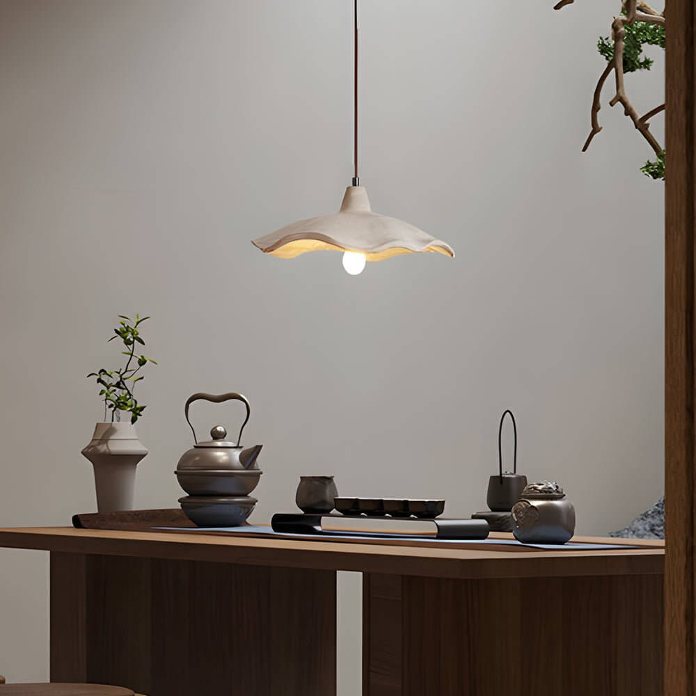 Close-up of the sculpted wave silhouette on the Aureon cement pendant light