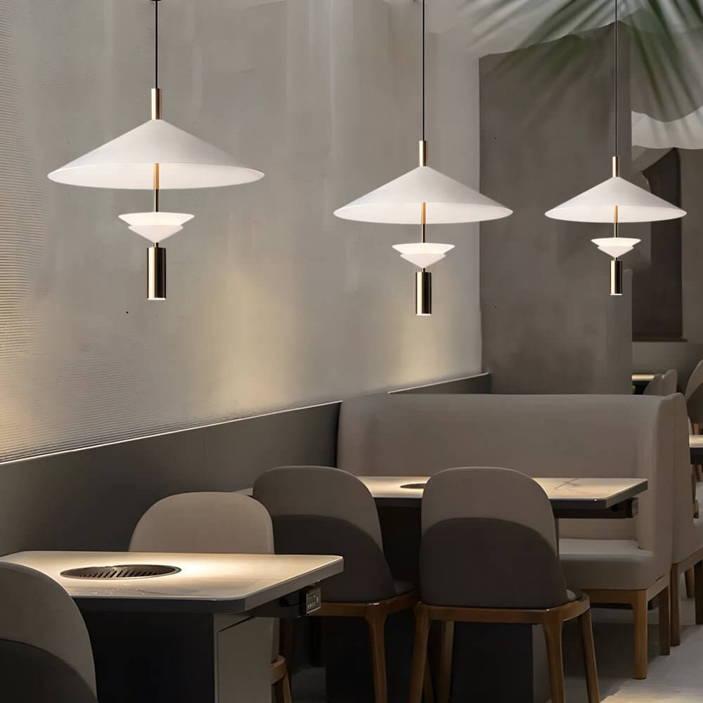 Aureon iron pendant light with integrated spotlight in white, shown in a modern living room setting