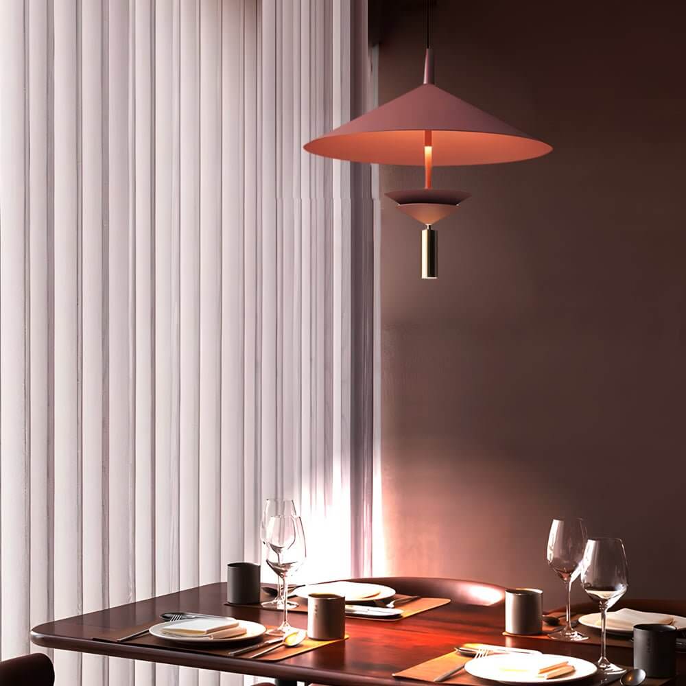 Aureon red iron pendant light close-up showing hat-form shade silhouette and cord mount