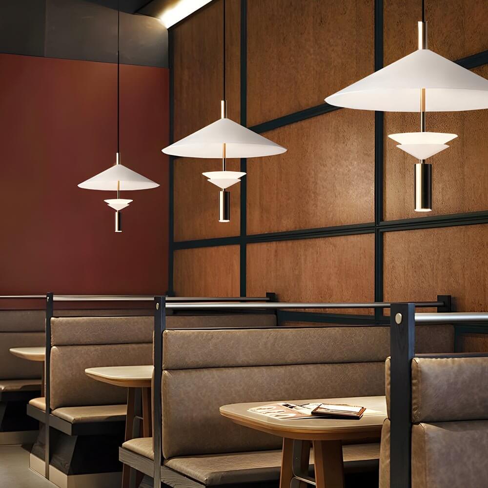 Aureon white iron pendant light illuminated, warm and neutral colour temperature shown in bedroom