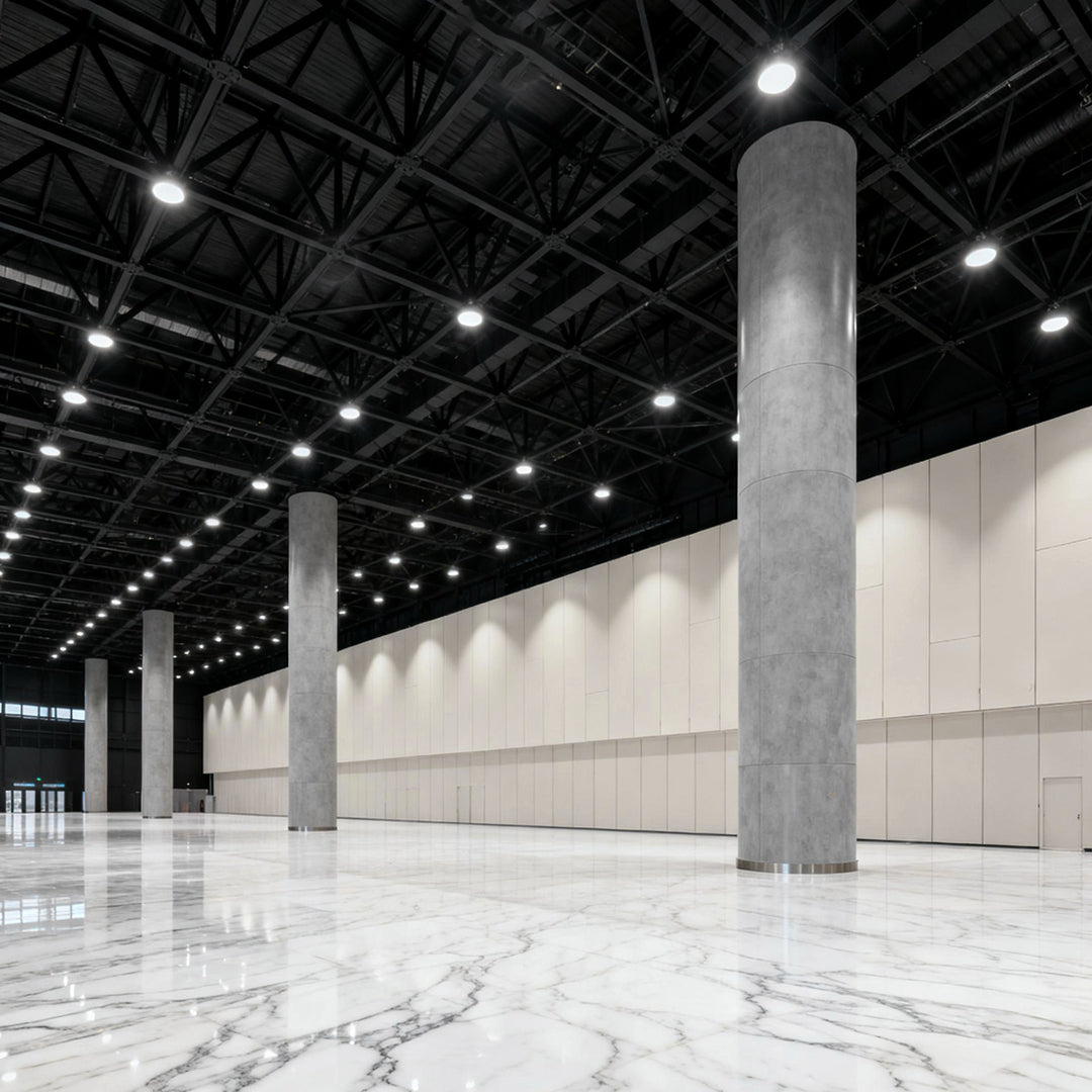 Aureon industrial LED pendant light providing uniform illumination in a modern warehouse with concrete floors