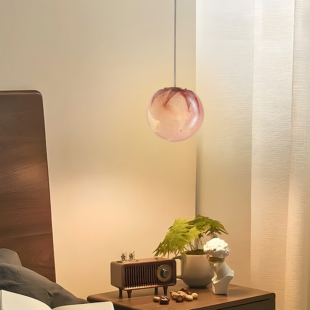 Rose gold glass globe pendant lights in a modern living room