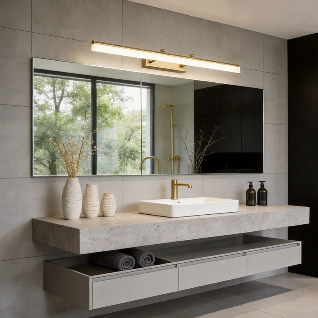 Long gold LED bathroom vanity light above double sink in contemporary bathroom