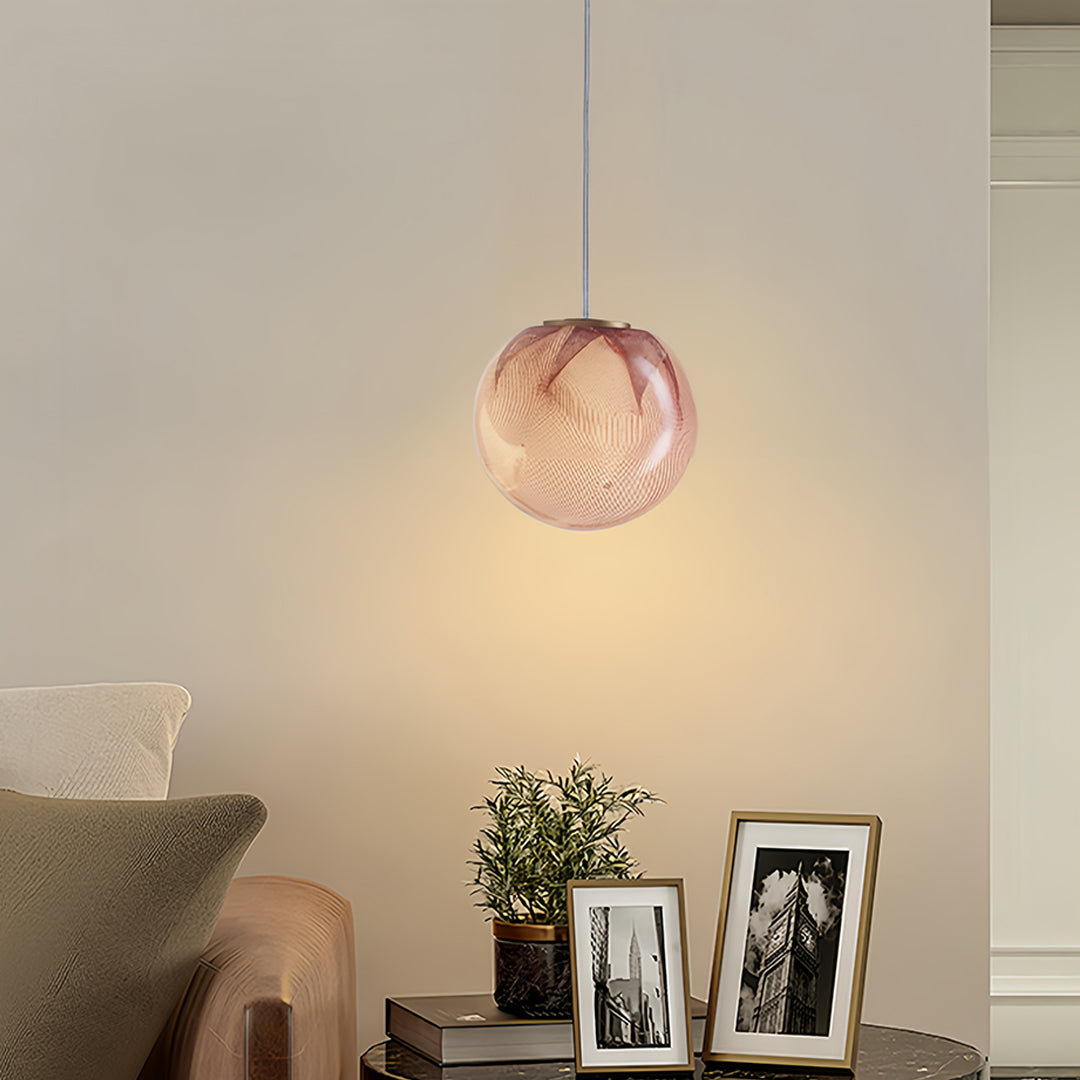 Luxury copper glass sphere pendant light against a neutral background
