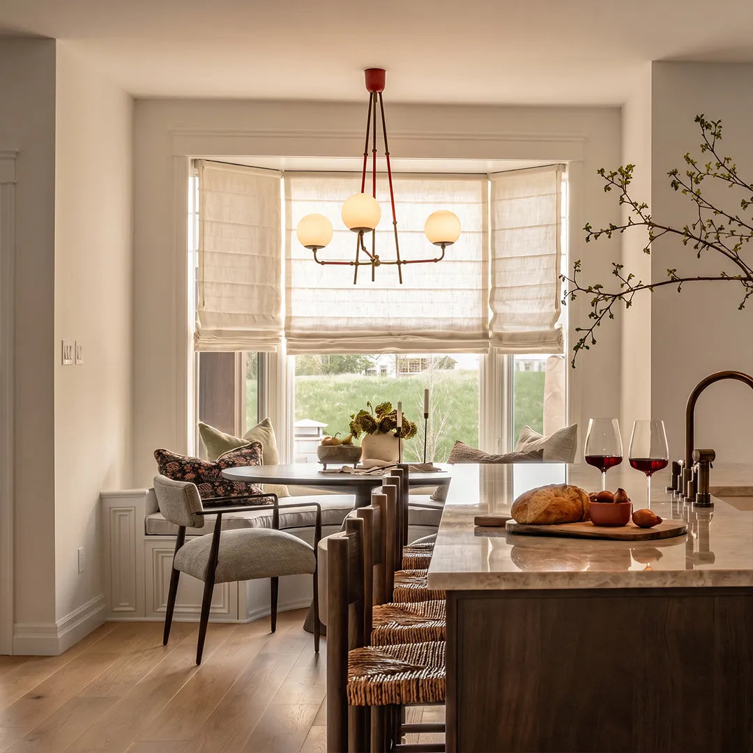 Auréline mid-century copper chandelier illuminating a contemporary dining area