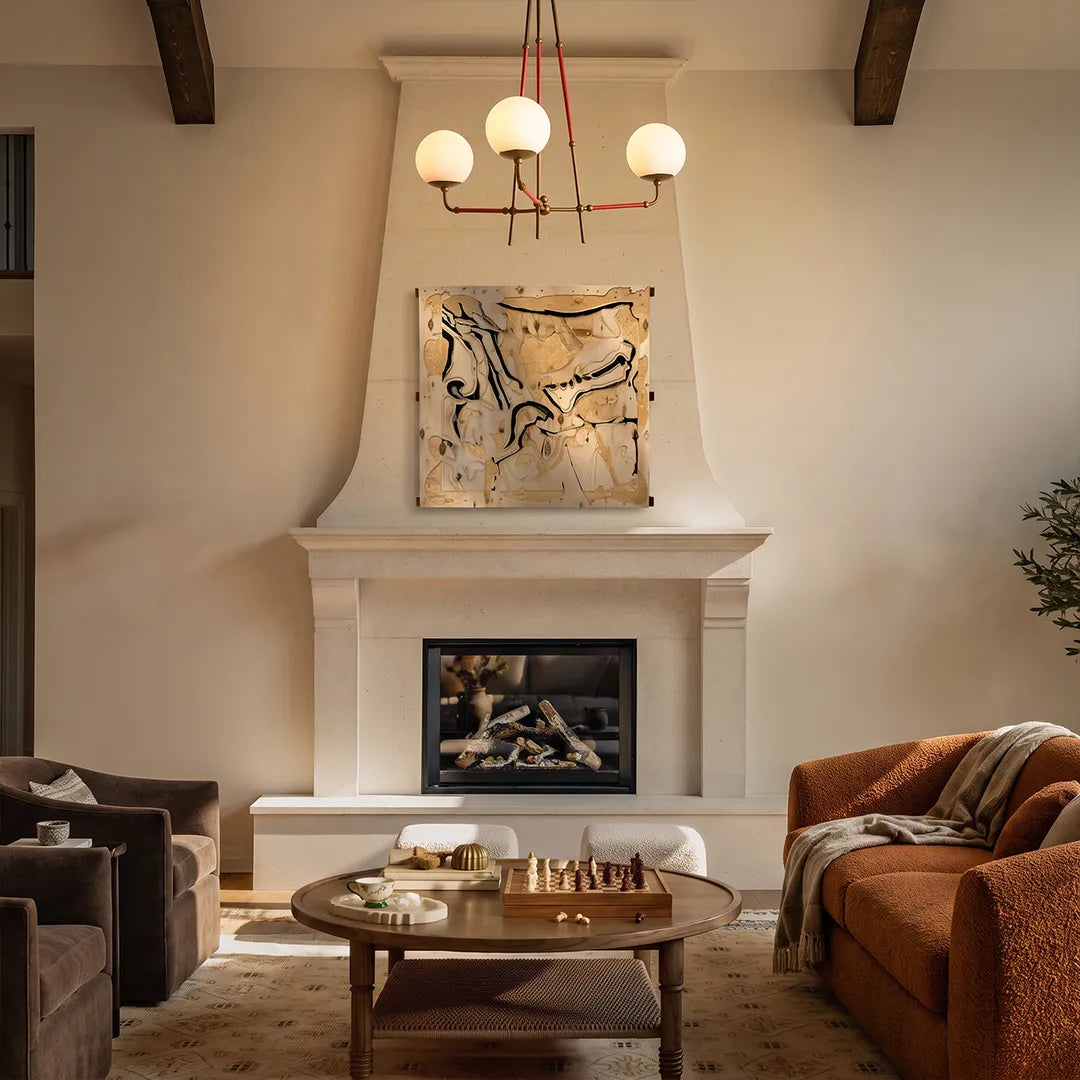 Auréline iron and glass chandelier above a fireplace seating area in a living room