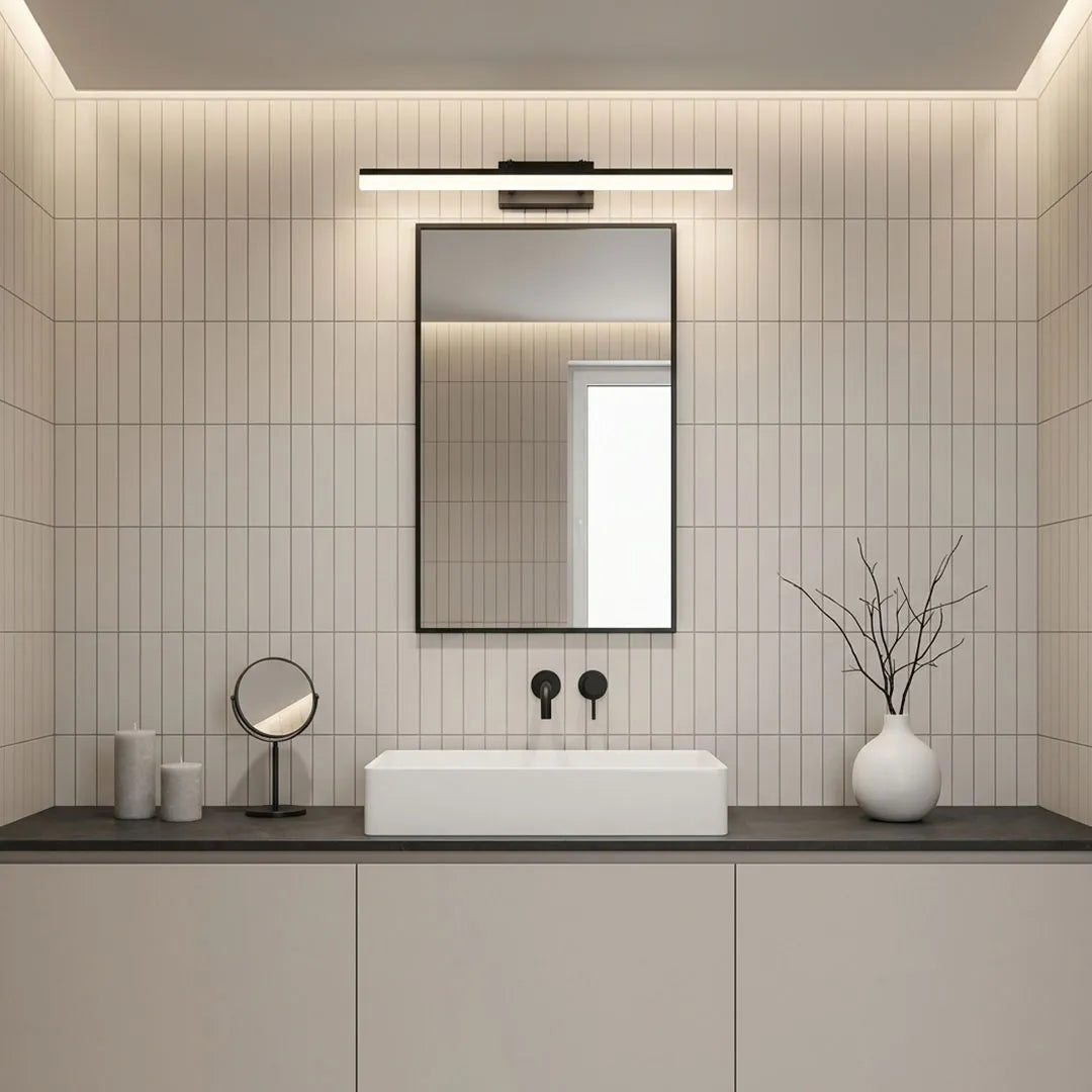 Minimalist gold LED vanity wall light above mirror in modern gray bathroom