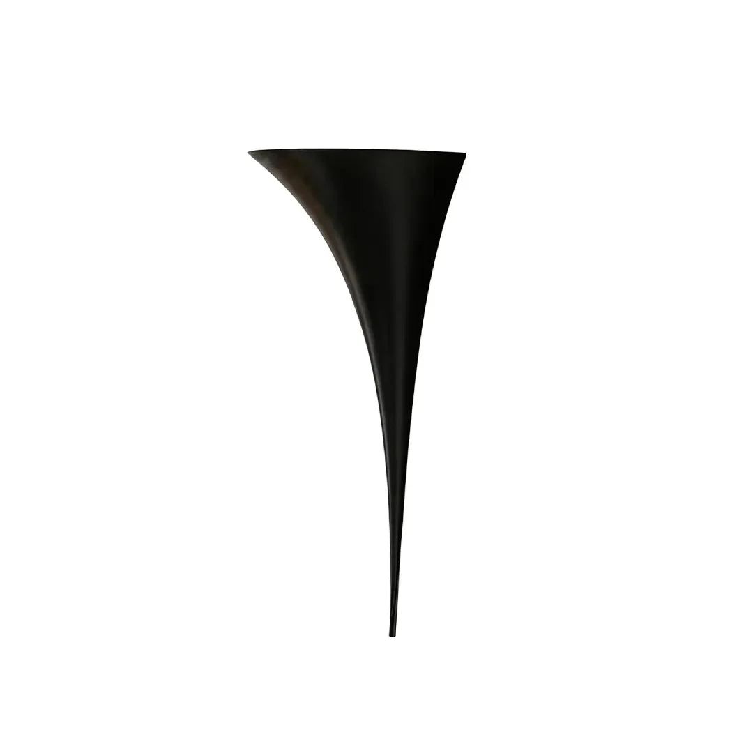 Sculptural brass wall sconce in black finish, small size, contemporary interior
