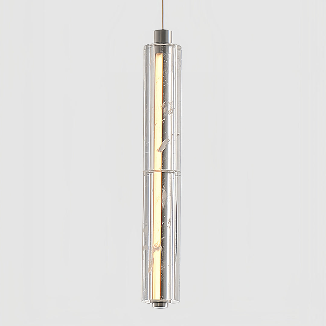 Aureon chrome crystal pendant light hanging by a window with warm glowing light in a serene bedroom