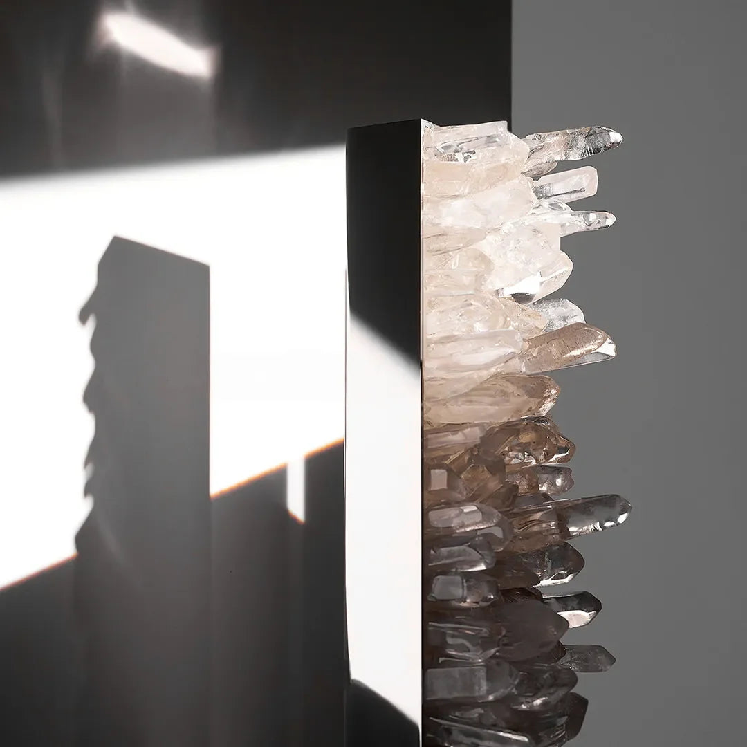 Close-up of Niva crystal wall light showing natural crystal detail and silver stainless steel frame