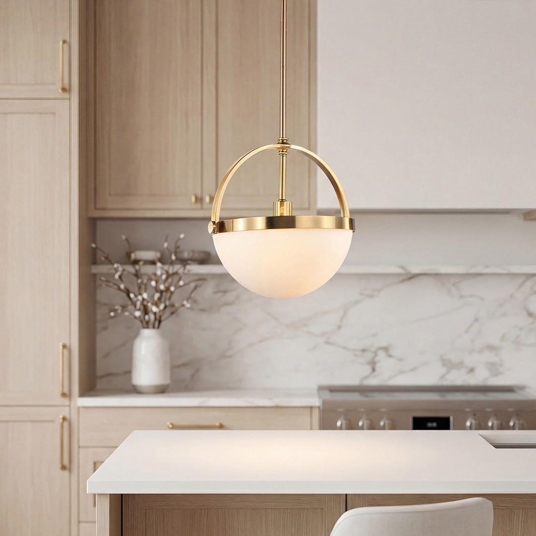 Aureon gold and white pendant light with copper body and frosted glass shade, against a bright minimal backdrop