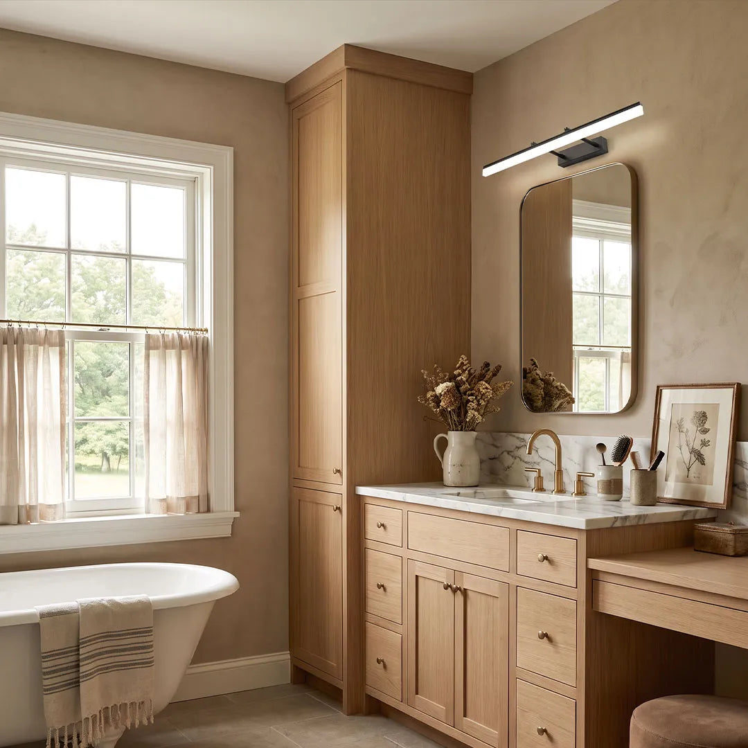 Modern gold bathroom vanity light in bathroom with wood vanity and warm lighting