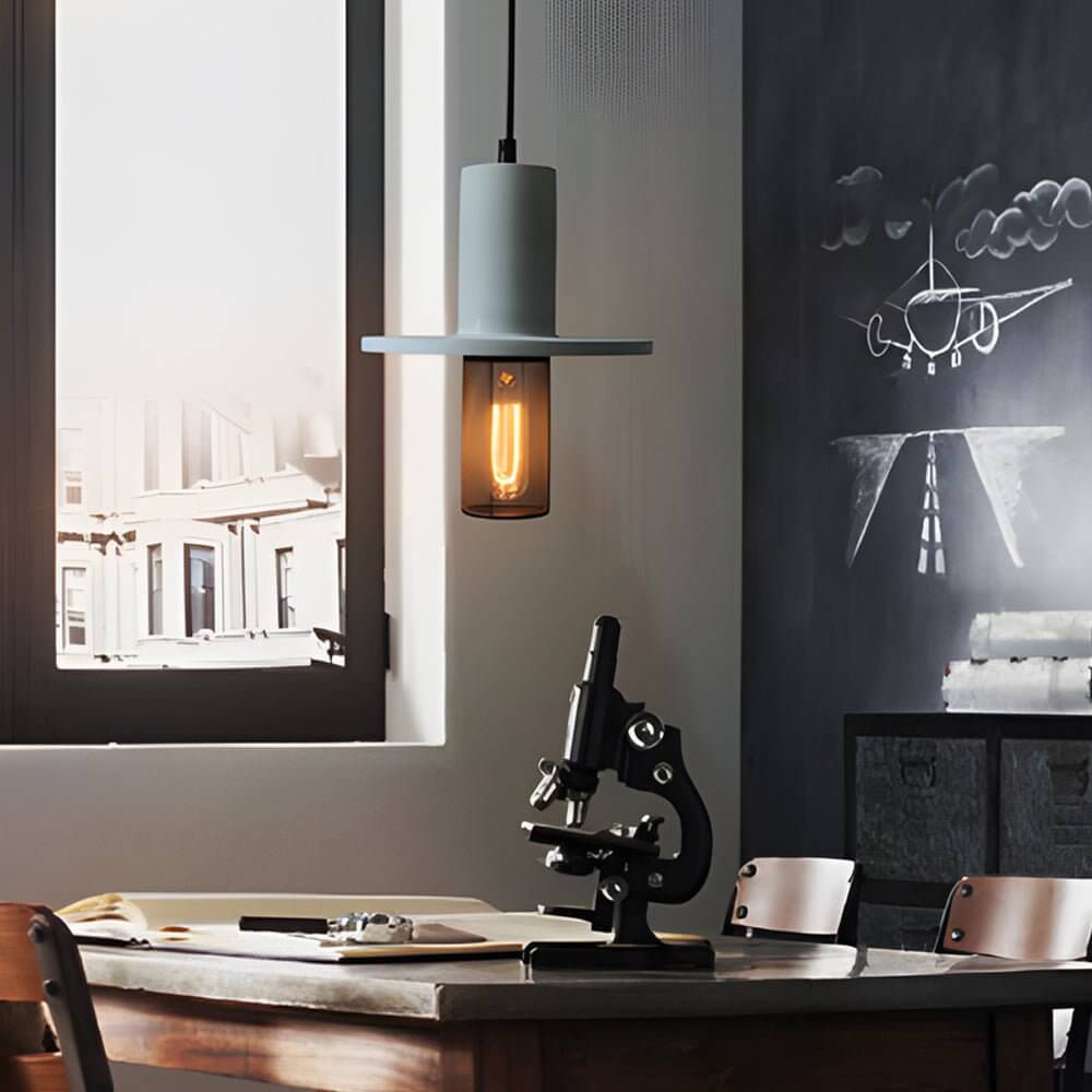 Close-up of Aureon cement pendant light showing mesh iron lower shade detail