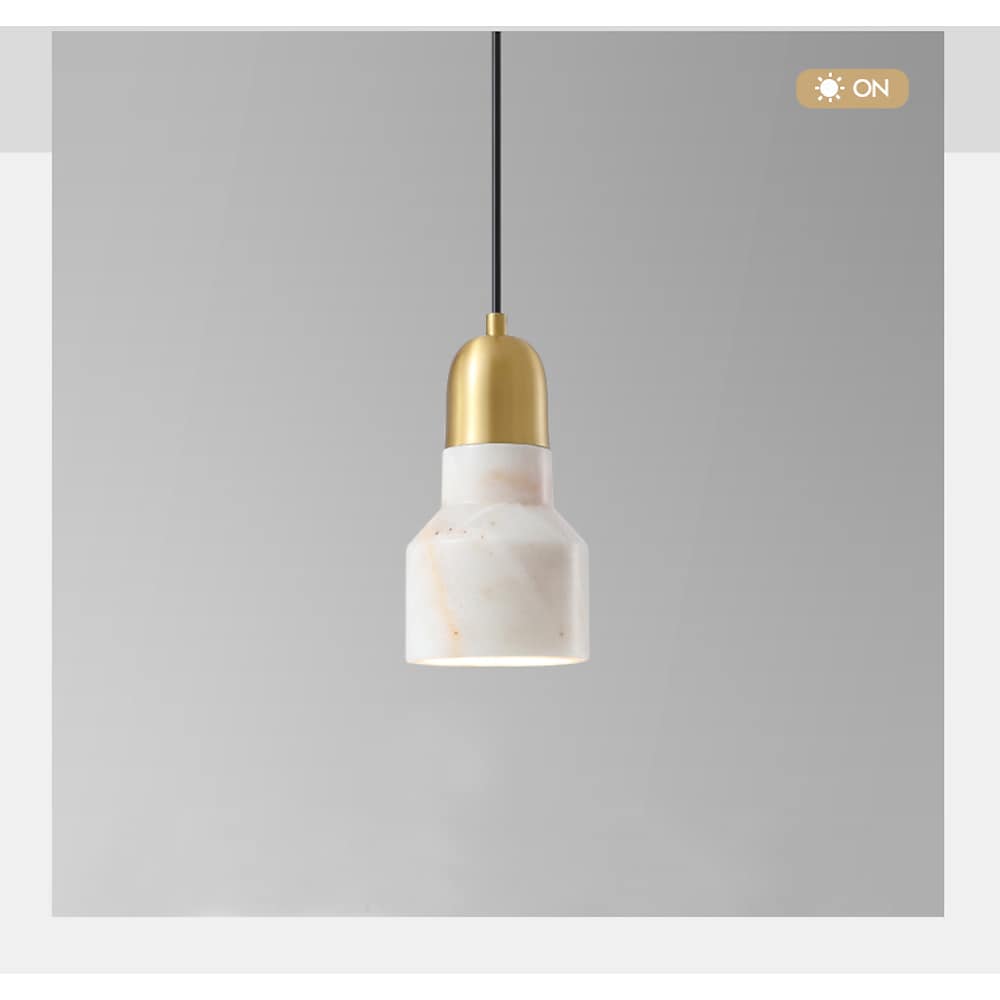 Aureon marble drum pendant light in ivory finish, shown in a minimalist interior