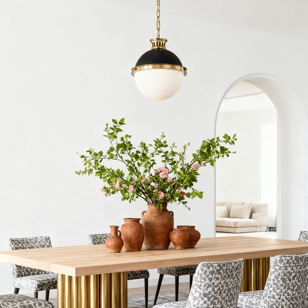 Aureon oversized glass globe ceiling pendant light in a room with an arched doorway