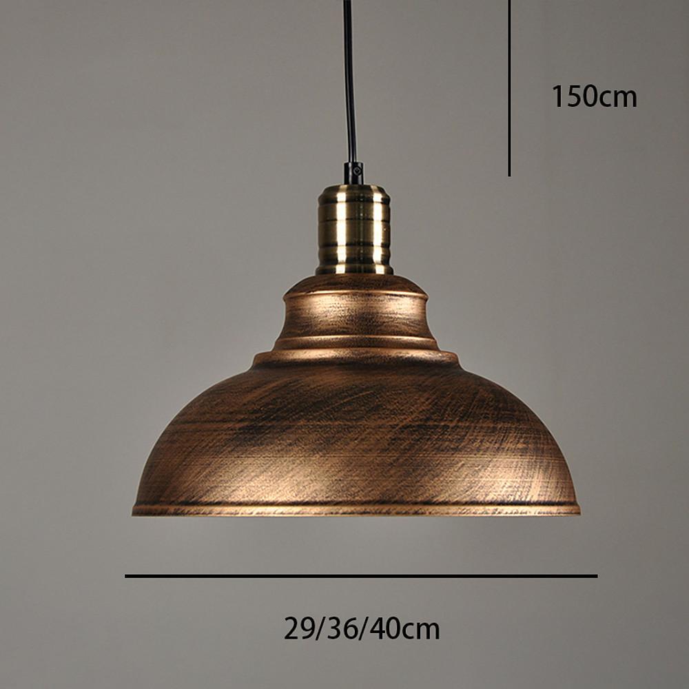 Aureon dome pendant light above a dining table, industrial modern metal shade with focused downlight