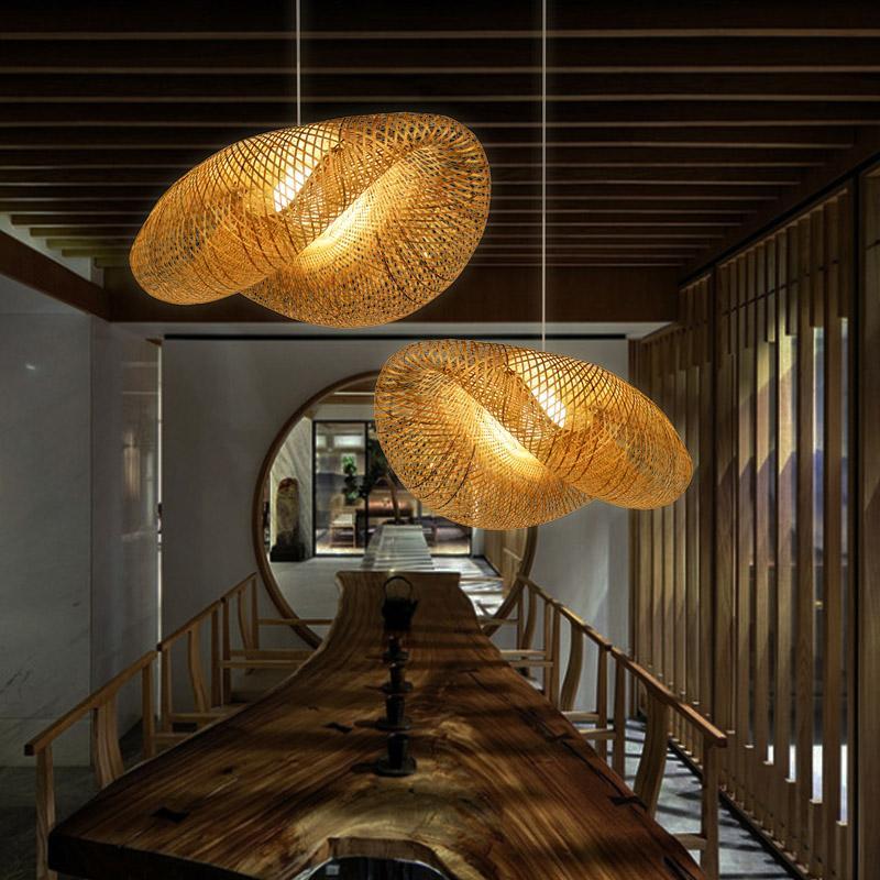 Rattan curved pendant light above a modern dining table