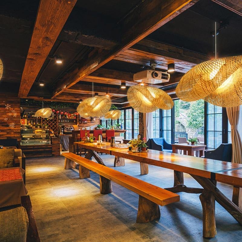 Woven rattan arch ceiling light in a rustic restaurant setting