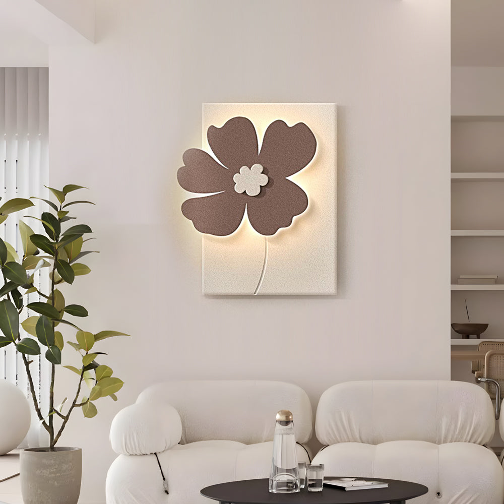 3D floral relief LED wall light casting warm ambient light in a modern room