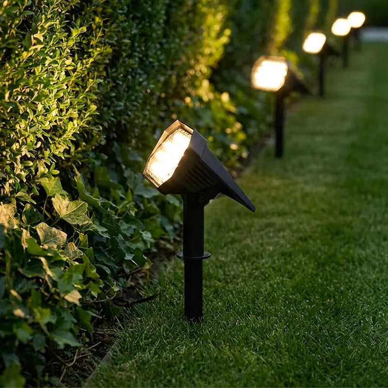 Set of Solvara solar landscape stake lights placed along a garden lawn border