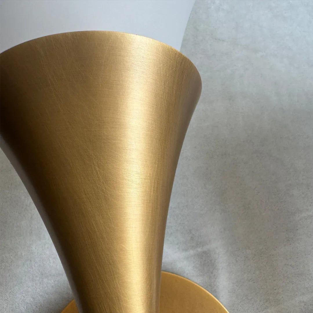 Close-up detail of Niva antique brass wall sconce body and finish