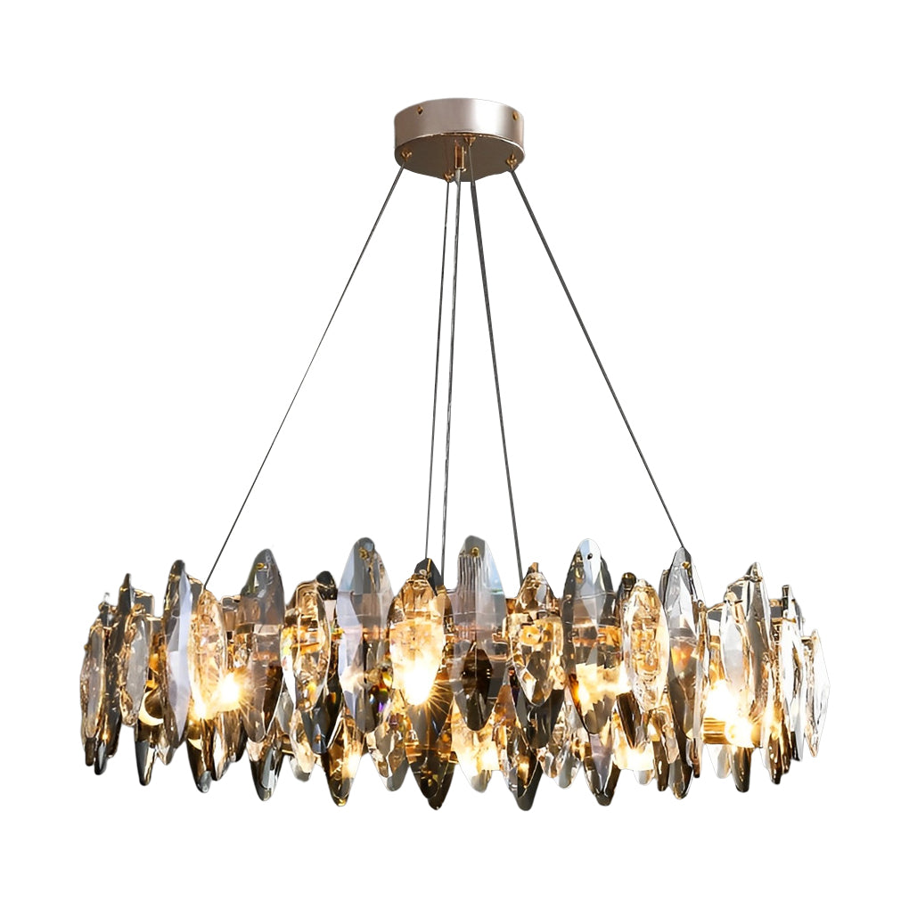 Round gold-frame chandelier with smoky crystal leaf pendants in a modern interior