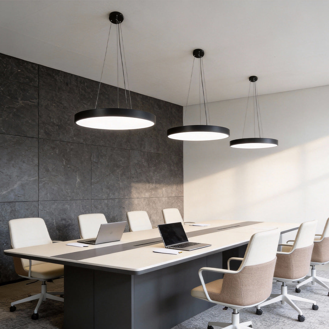 Round pendant lights arranged in a modern conference room