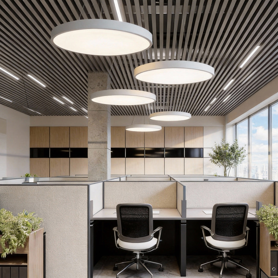 Circular LED pendant lights above cubicle office desks