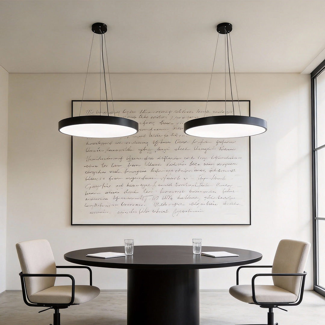 Aureon circular pendant lights in a modern meeting room