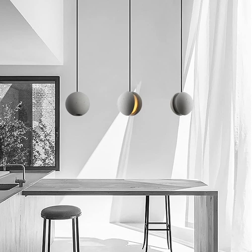 Aureon 14-inch ceramic globe ceiling light as a focal pendant in a living room
